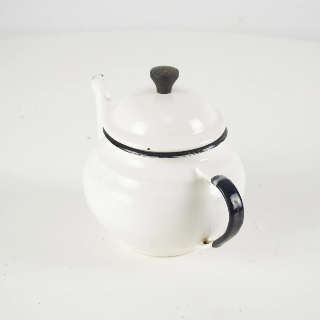 Vintage small white enamelware teapot. Vintage white enamel kettle pot