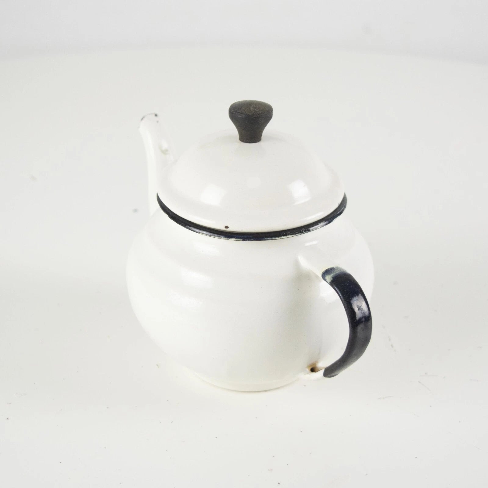 Vintage small white enamelware teapot. Vintage white enamel kettle pot