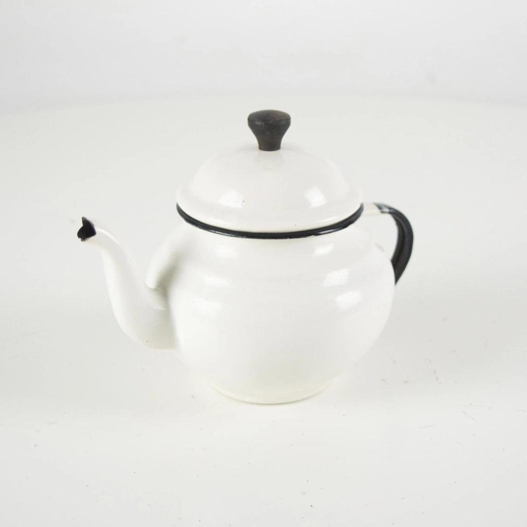 Vintage small white enamelware teapot. Vintage white enamel kettle pot