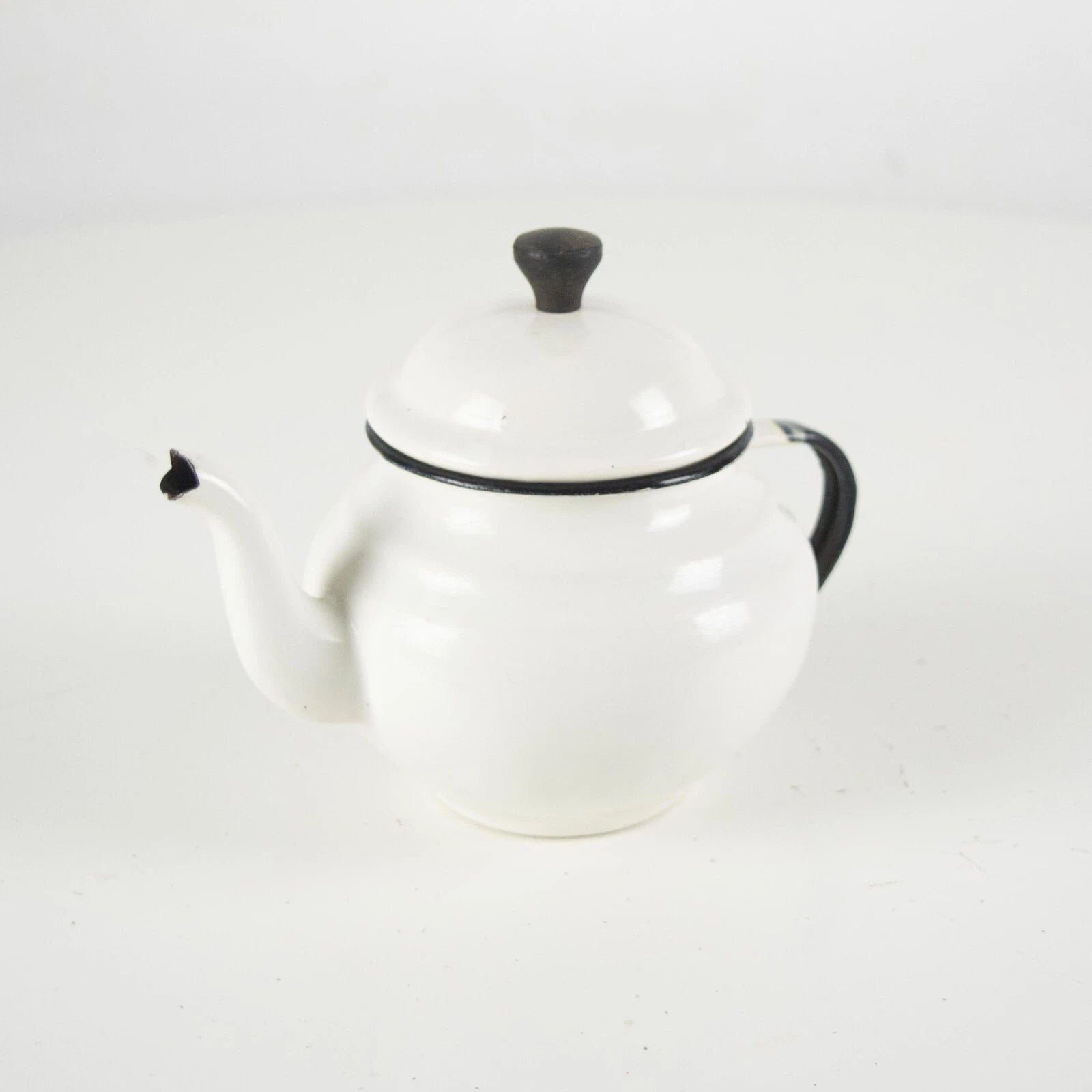 Vintage small white enamelware teapot. Vintage white enamel kettle pot