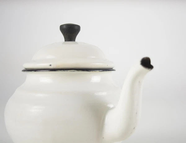 Vintage small white enamelware teapot. Vintage white enamel kettle pot